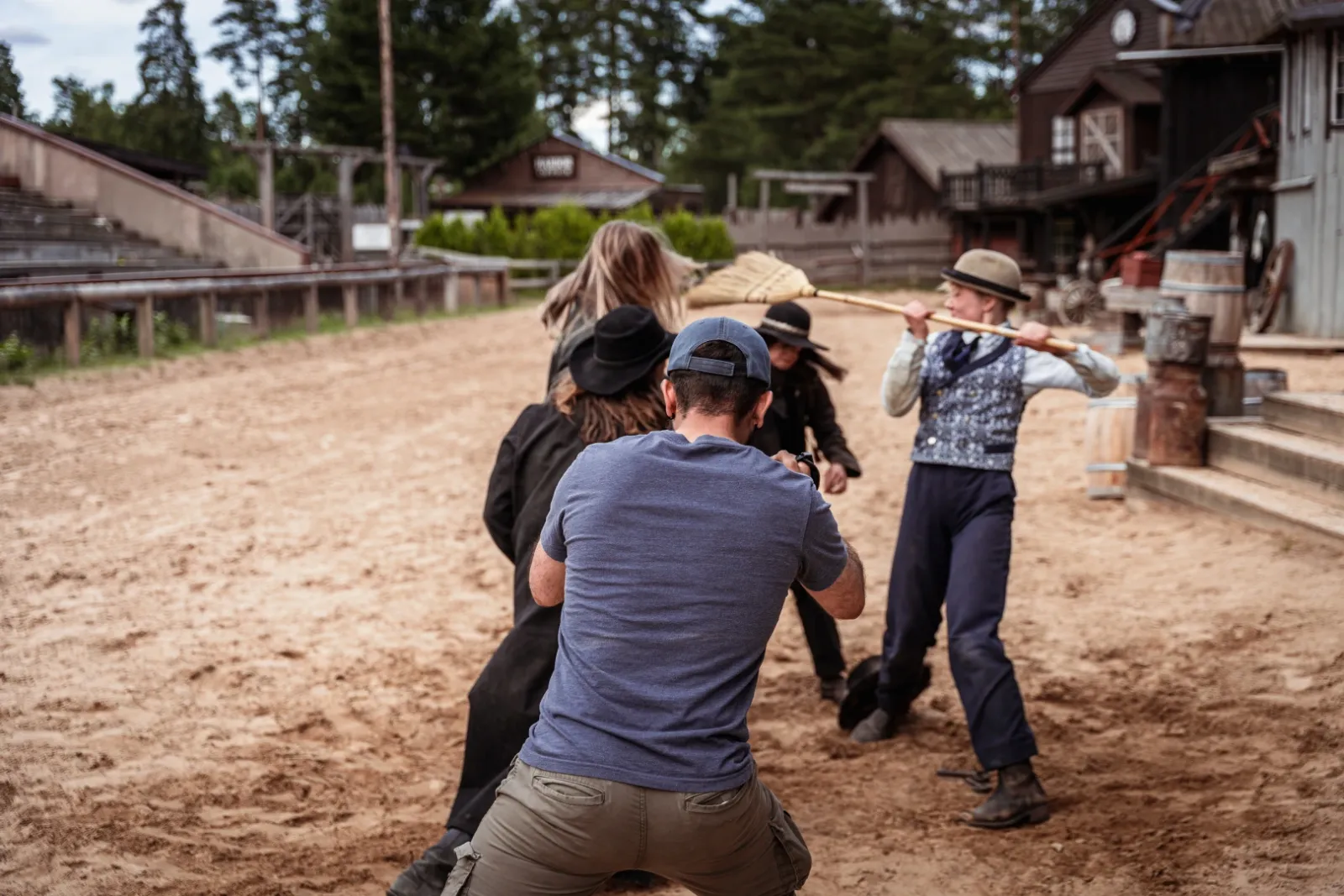 Bertan directing a fight between actors in a western street on the set of Josephine The Banker